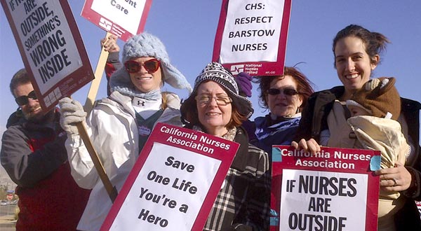 Nurses holding signs