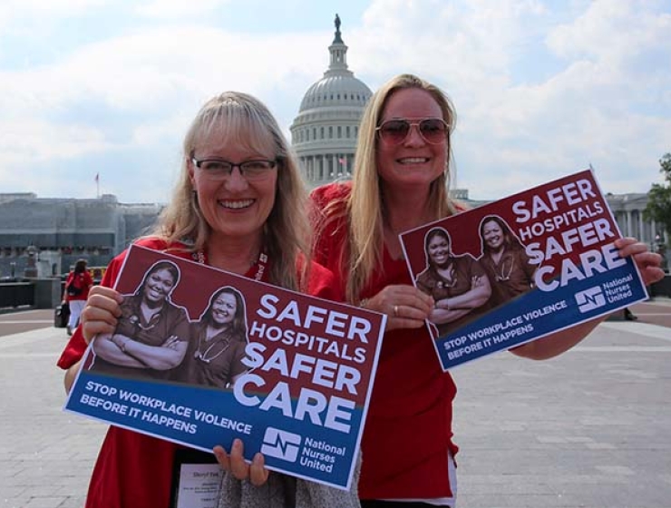 Nurses outside capitol building hold signs calling for safe workplaces