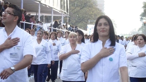 Argentina nurses with hands over hearts