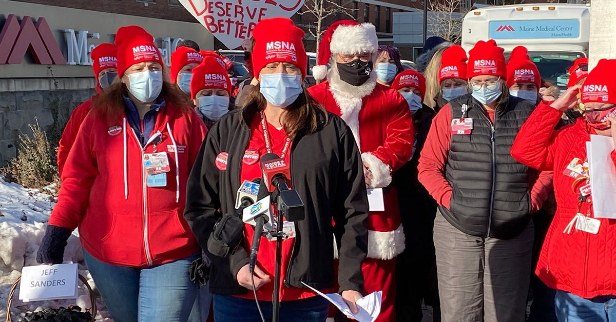 Large group of Maine Medical Center nurses ouside hospital holding press conference