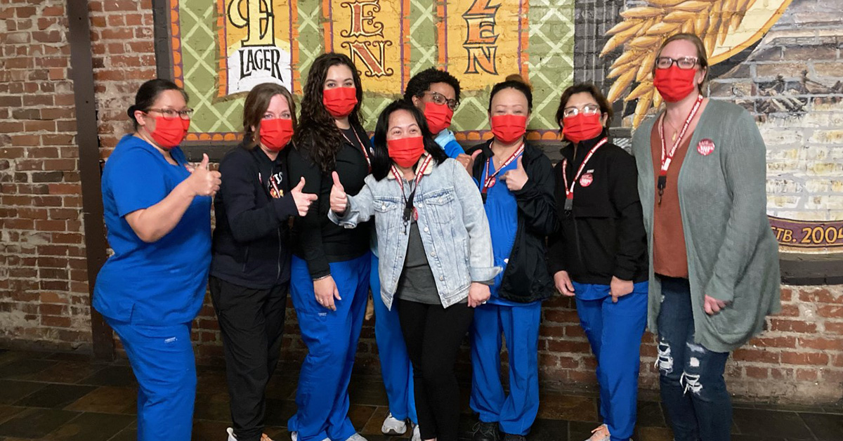 Group of nurses giving thumbs up