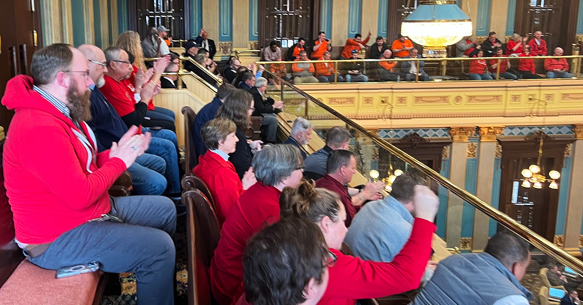 Nurses inside Michigan capitol building applauding