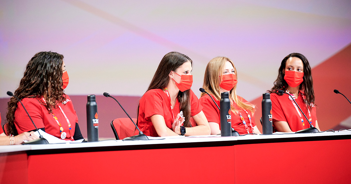 Four nurses sitting onstage for convention panel