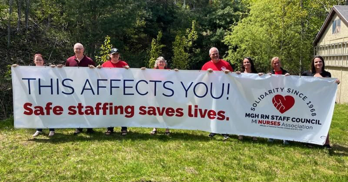 8 people holding banner "This Affects You: Safe Staffing Saves Lives"