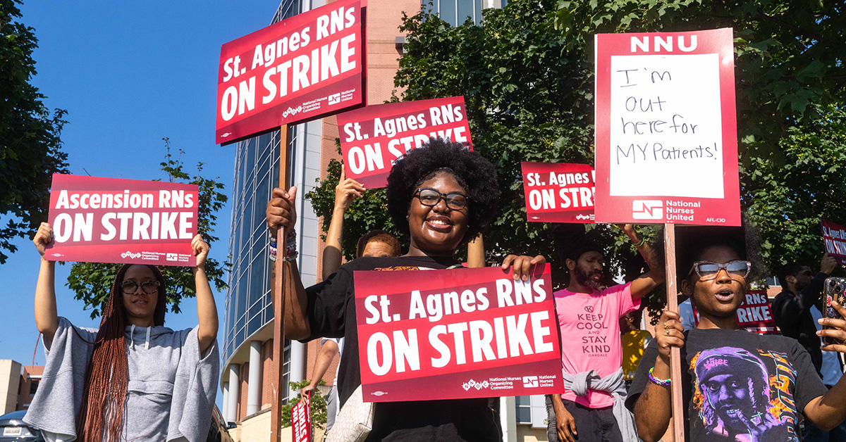 Nurses outside holding signs "St. Agnes RNs On Strike"