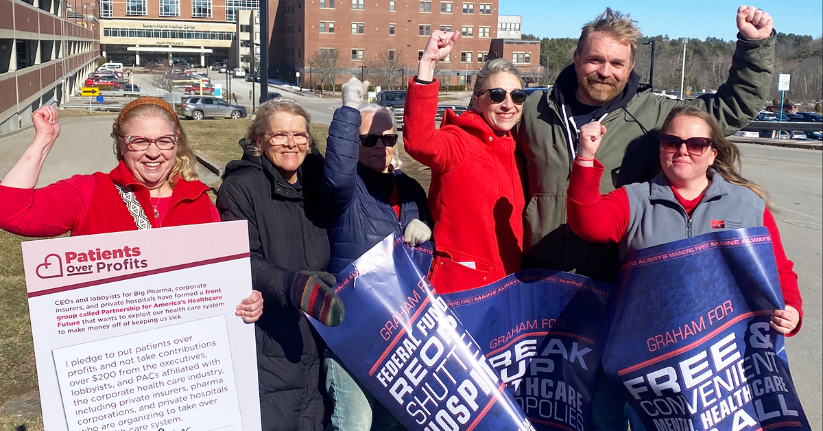 Nurses with Graham Platner, raising fists