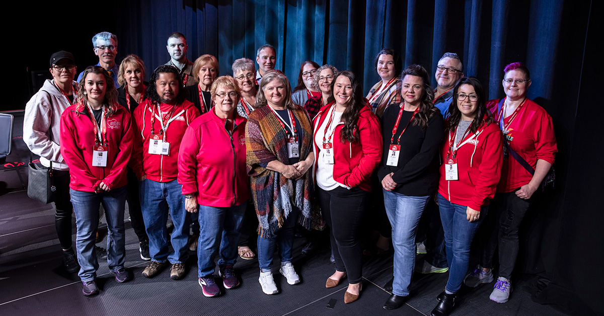 Large group of nurses side-by-side, inside, at convention