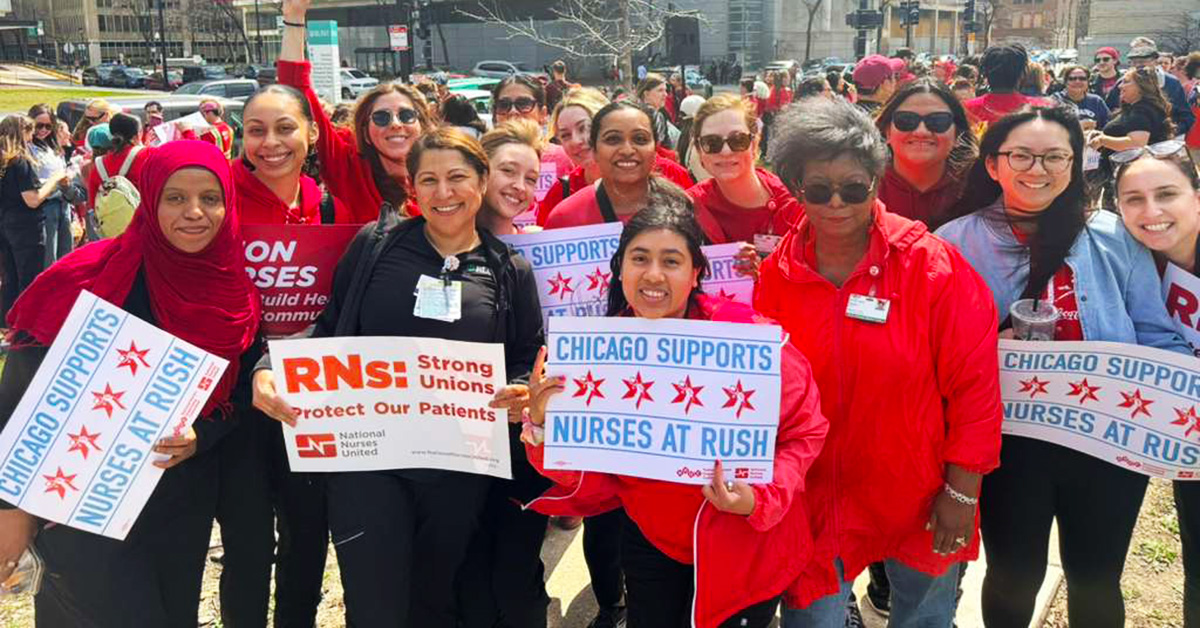 Group of nurses outside, smiling, holdinhg signs "Chicago Supports Nurses at Rush"
