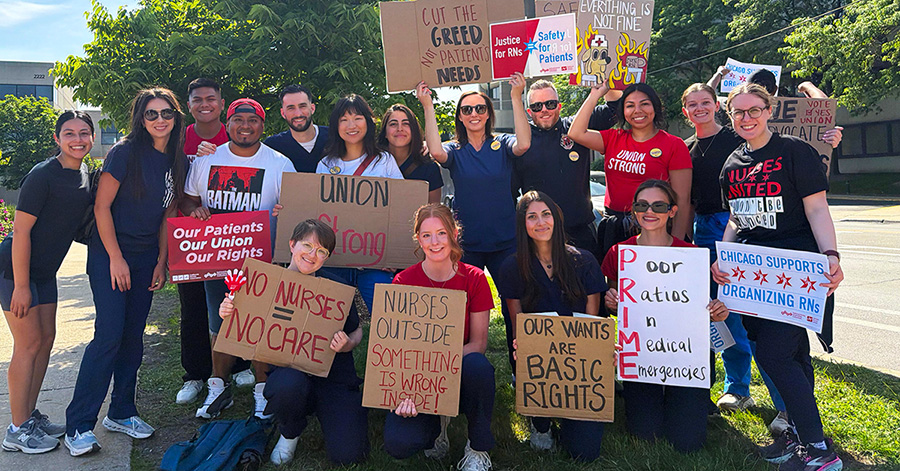 Large group of nurses outside holding signs calling for union rights, patient care, and an end to hospital greed
