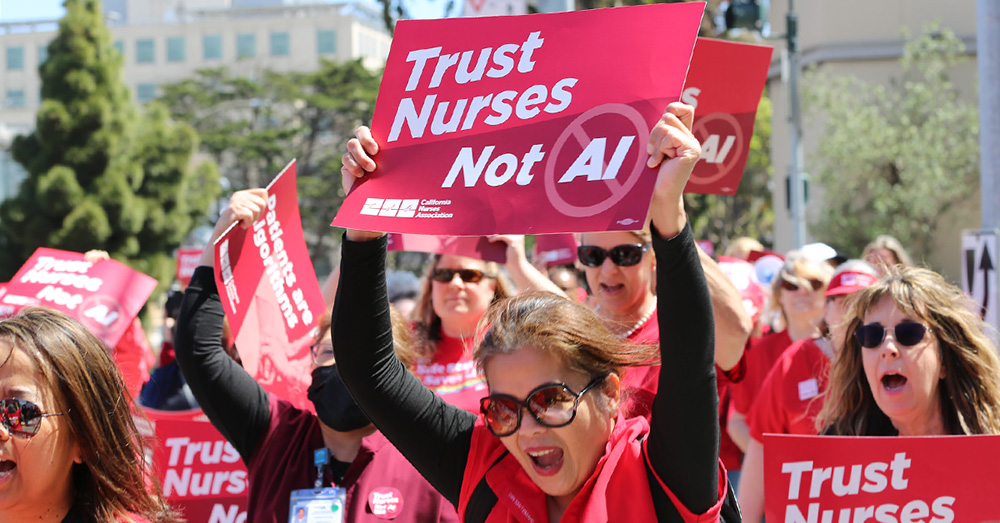 Nurses marching, holding signs "Trust Nurses Not A.I."