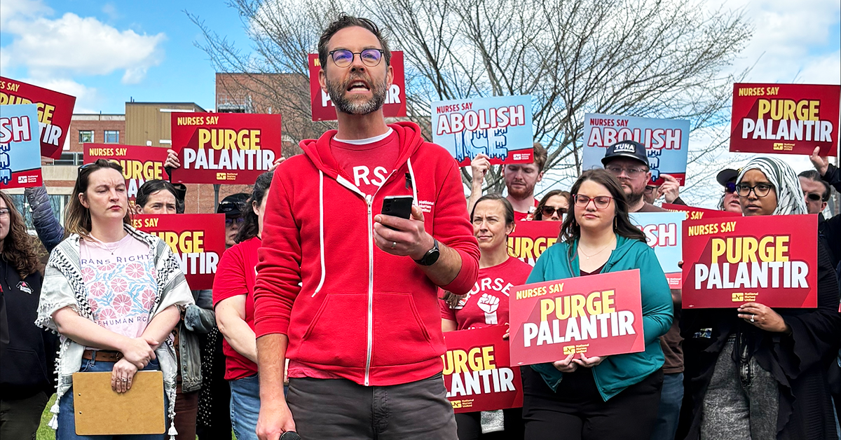 Maine nurses holding signs "Nurses say Purge Palantir" and "Nurses say Abolish ICE"
