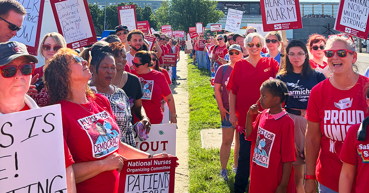 Rows of striking Wichita nurses, holding signs.