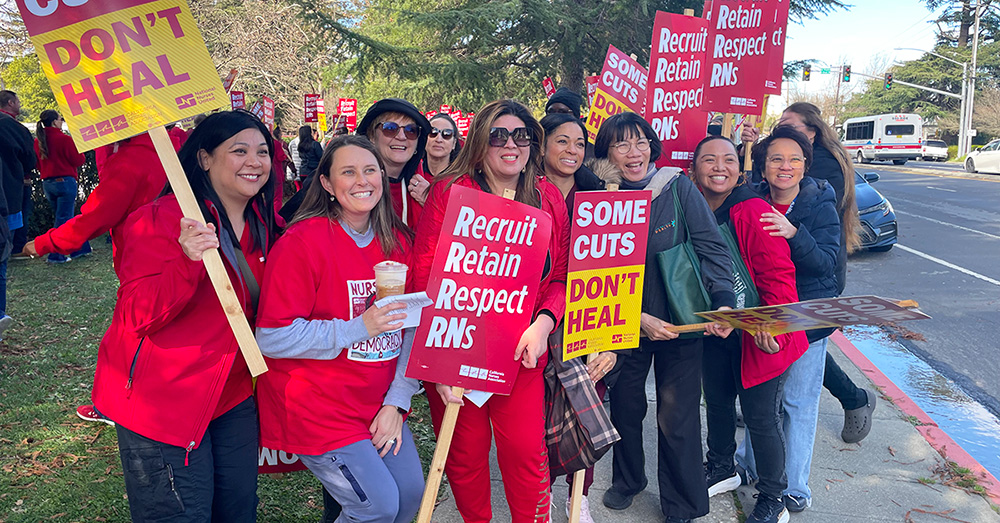 Nurses on picket line smiling