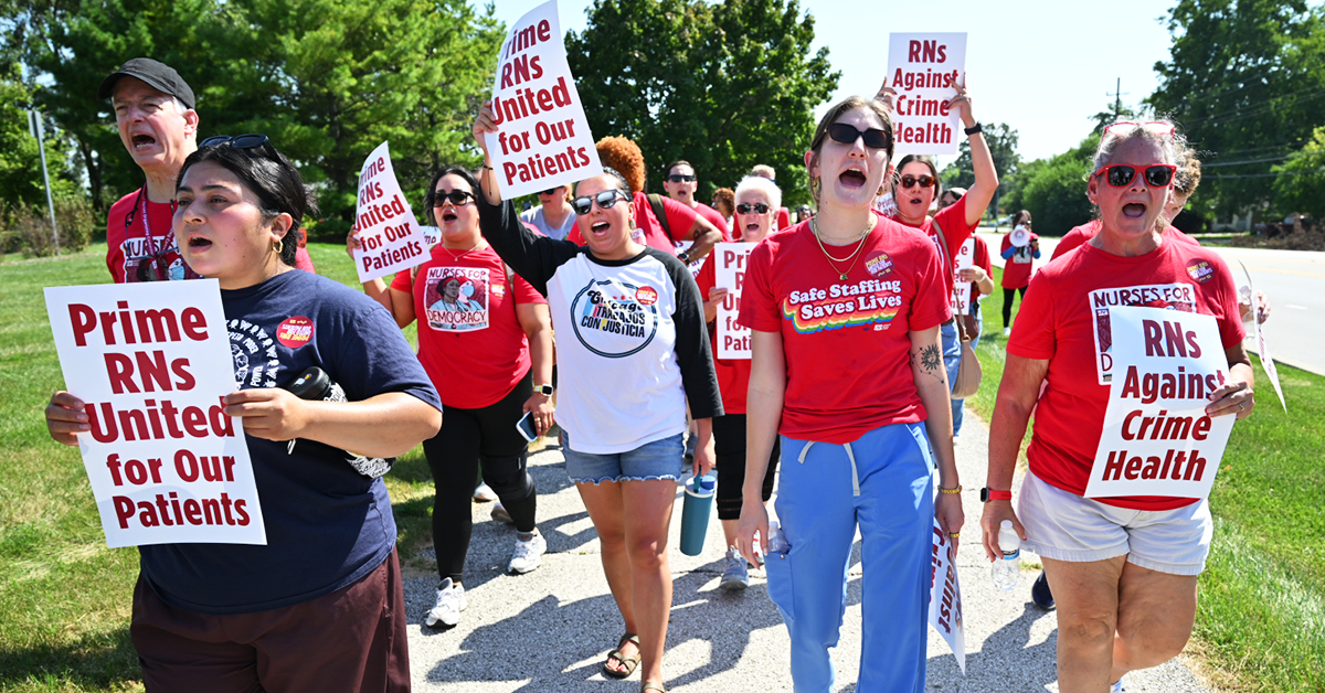 Community and nurses marching and holding signs "RNs Against Crime Health." Person with shirt "Safe Staffing Saves Lives"
