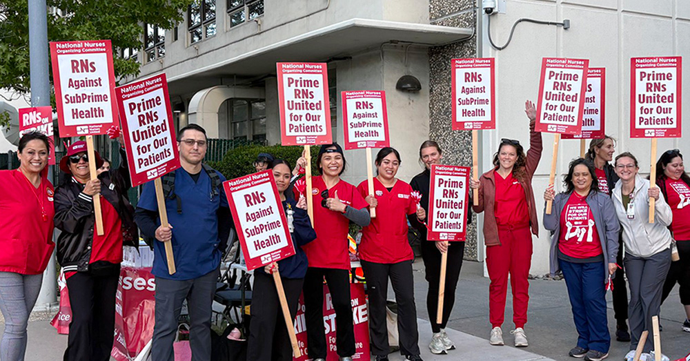 Nurses on strike line holding signs "Prime RNs United for our Patients"
