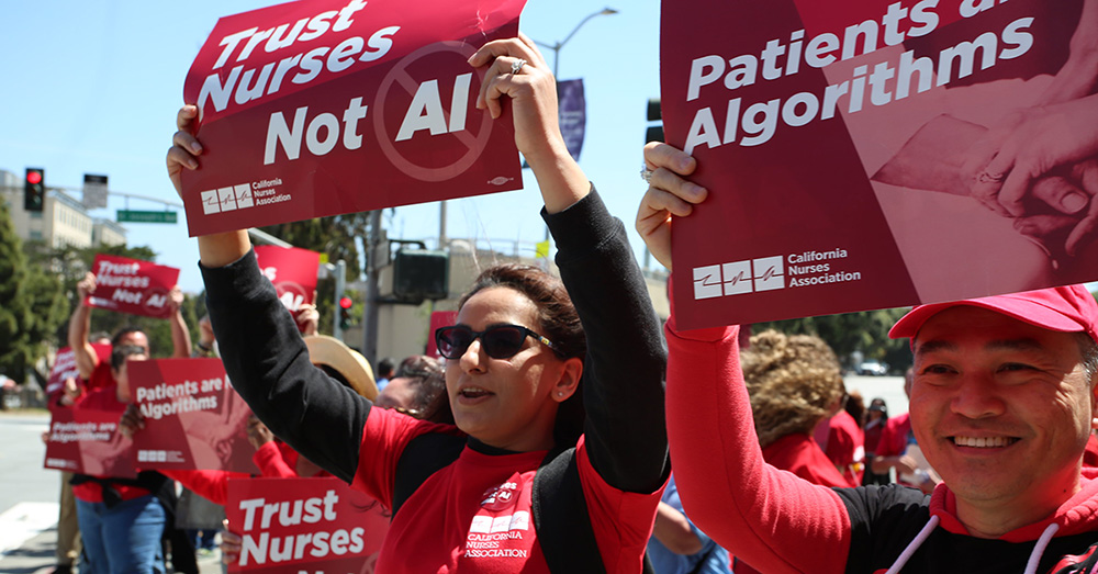 Nurses outside holding signs "Trust Nurses Not A.I."
