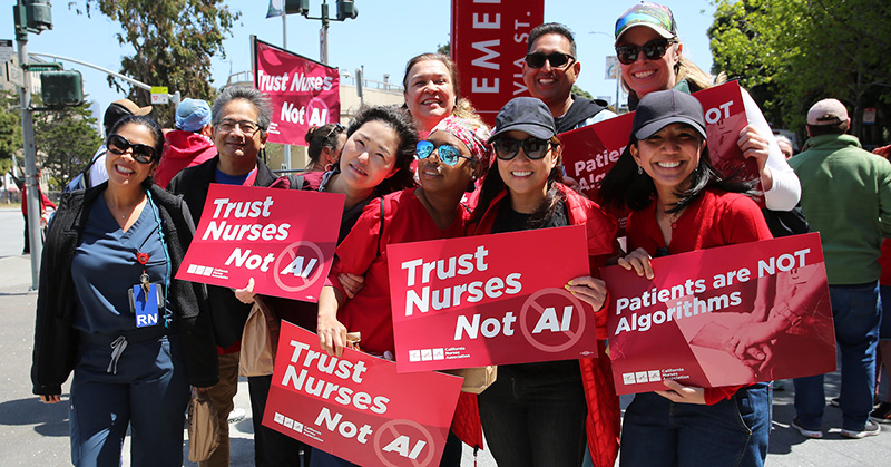 Nurses outside holding signs "Trust Nurses, Not A.I."