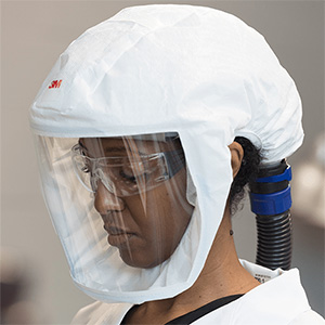 Person wearing PAPR respirator
