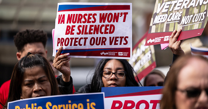 Nurses at rally holding signs "VA Nurses Won't be Silenced. Protect our Vets"