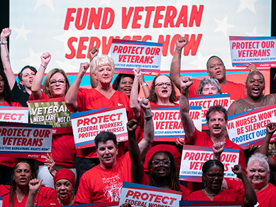 Nurses holding signs "Protect Our Veterans"