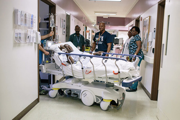 Eurey is moved via a self-driving gurney that does not need any force by the person driving it at the VA hospital in Loma Linda.