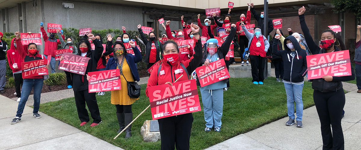 Nurses with raised fists