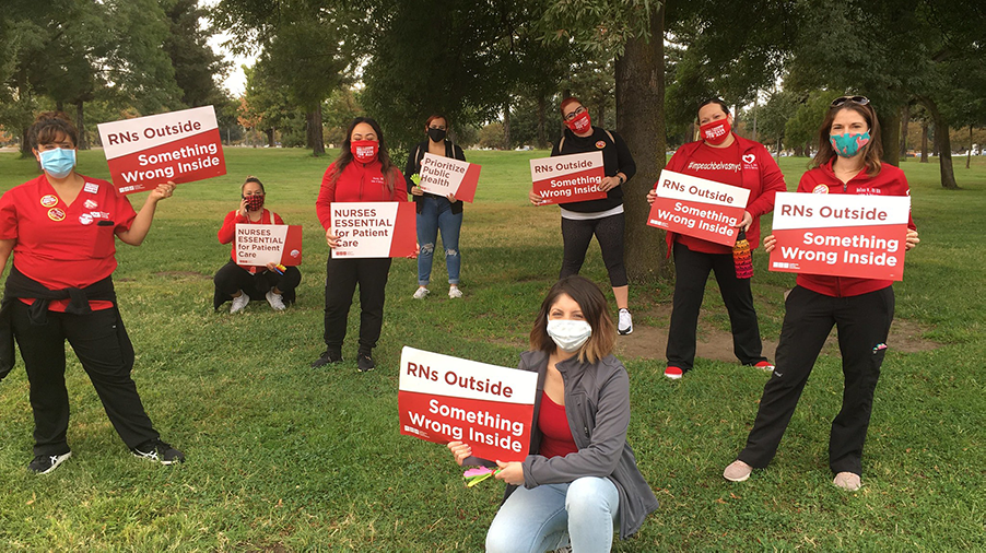 San Joaquin County RN hold signs "RNs Outside, something wrong inside"