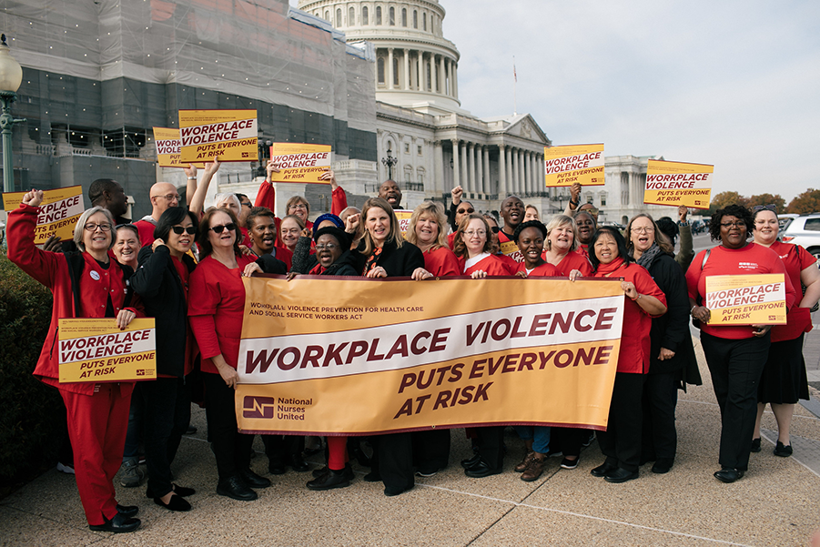 Nurses hold signs calling for Workplace Violence Prevention"