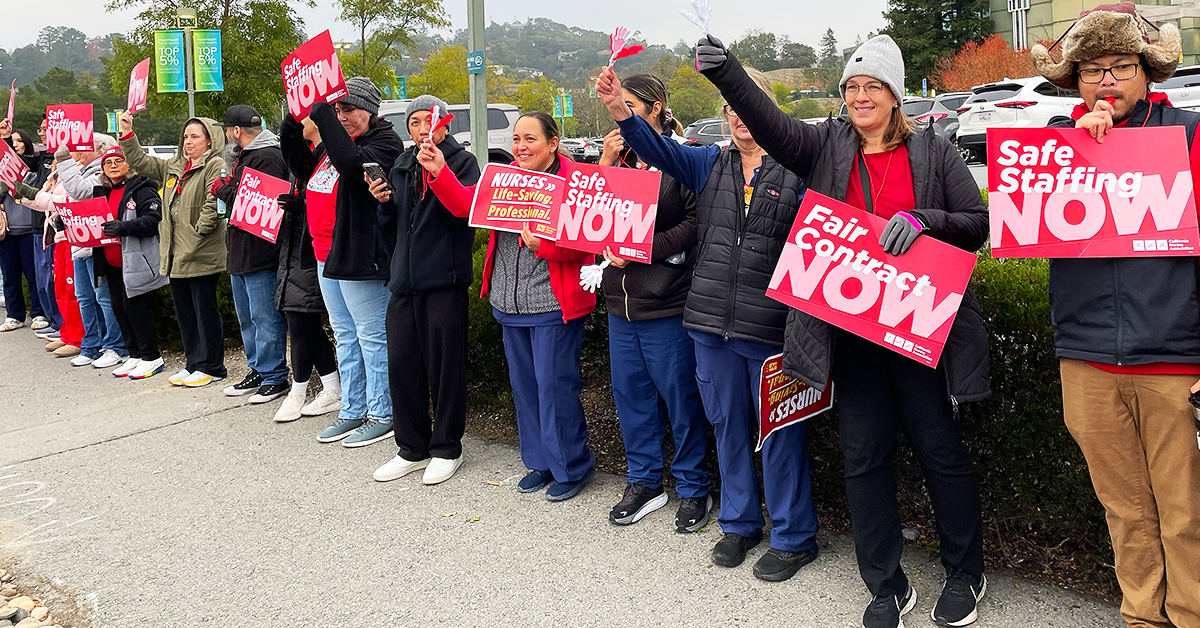 MarinHealth nurses in line with signs "Safe staffing now" "Fair contract now" "Nurses. Lifesaving. Professional"