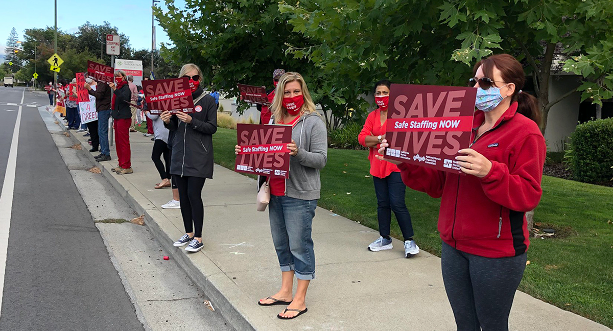 Good Samaritan RNs hold signs calling for safe staffing