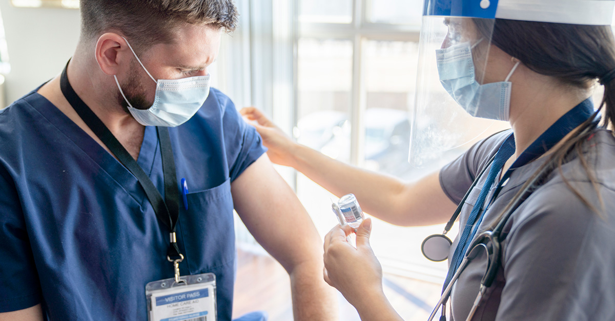 Nurse receiving vaccination