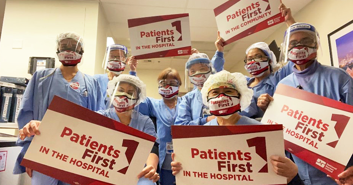 Nurses holding signs: "Patients First in the hospital"