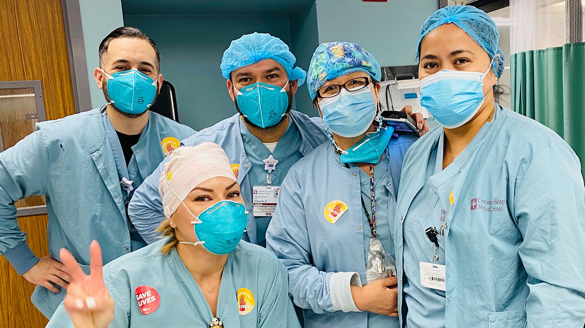 Group of five nurses inside hospital