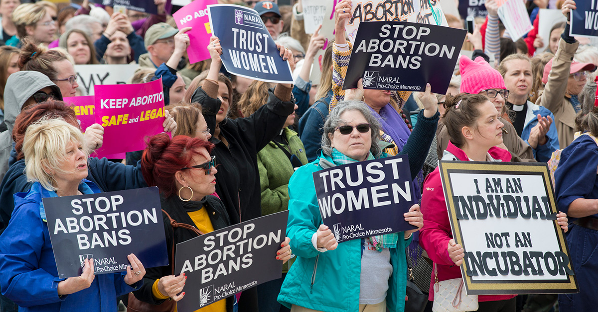 Large group of people holding Stop Abortion Bans Rally in St. Paul, Minnesota