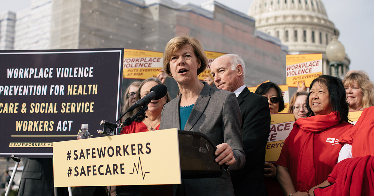 Senator Tammy Baldwin at podium outside Capitol Building