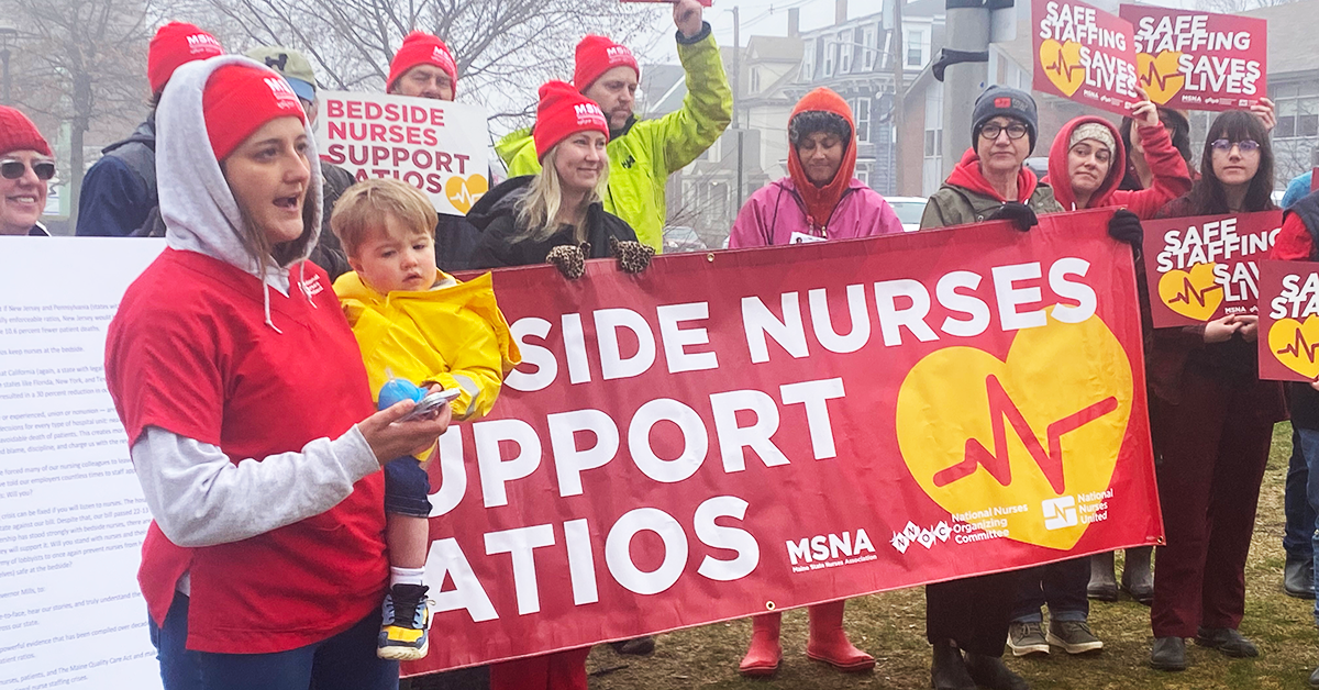 Maine nurses speaker at the presser with signs "Bedside nurses support ratios"