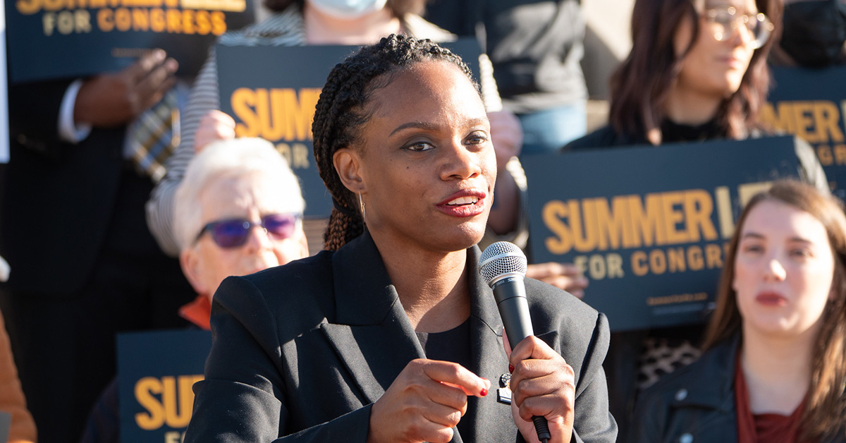 Congresswoman Summer Lee stands at podium