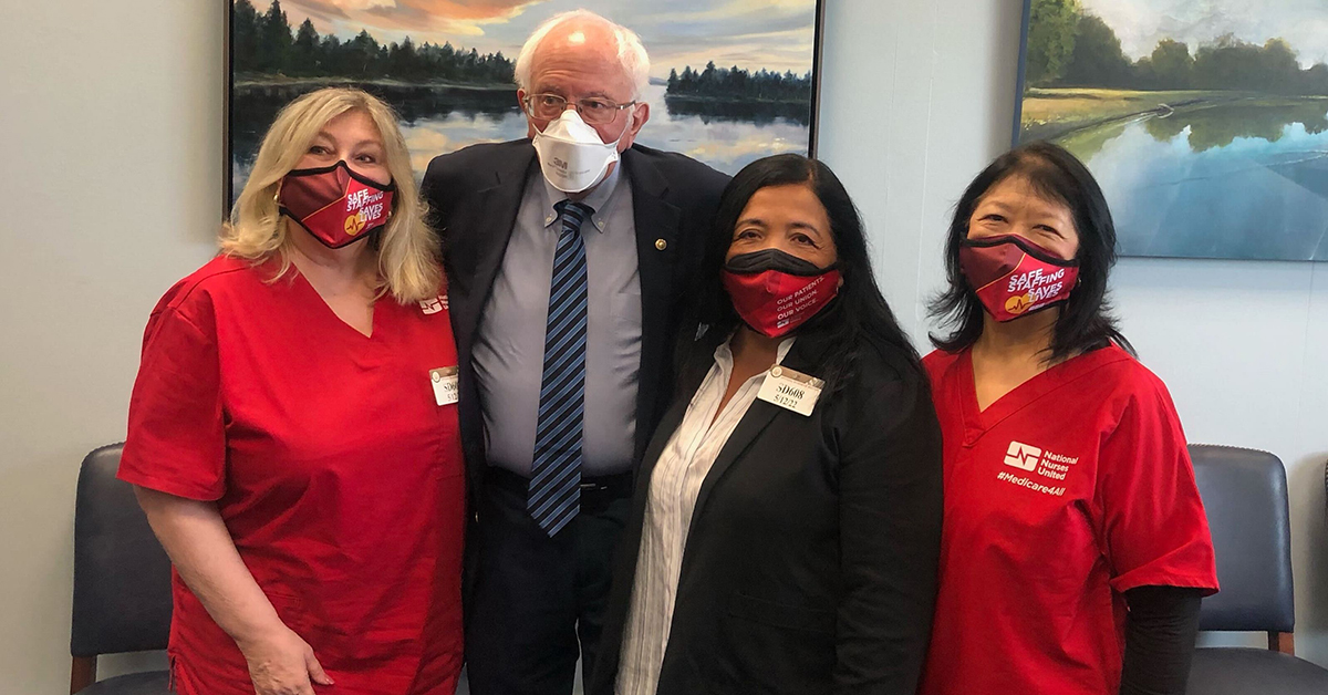 Group image of NNU President Jean Ross, RN; Senator Bernie Sanders; NNU Executive Director Bonnie Castillo, RN; and NNU President Zenei Triunfo-Cortez, RN