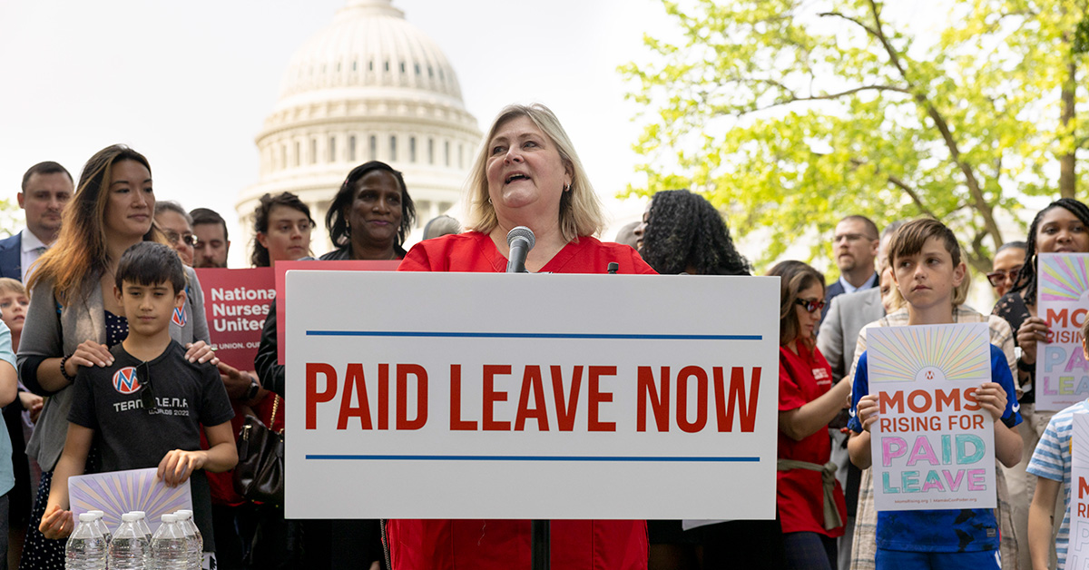 NNU President Jean Ross in front of podium