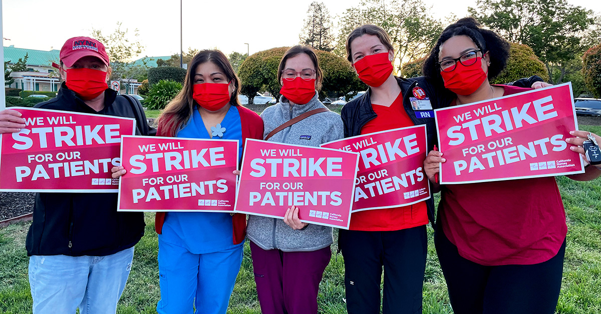 Five nurses hold signs "We will strike for our patients"