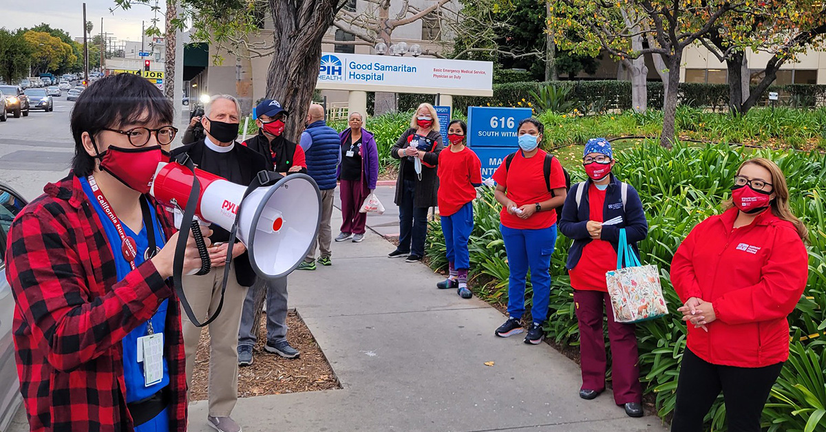 Nurses outside PIH Health Good Samaritan Hospital, one speaking through megaphone