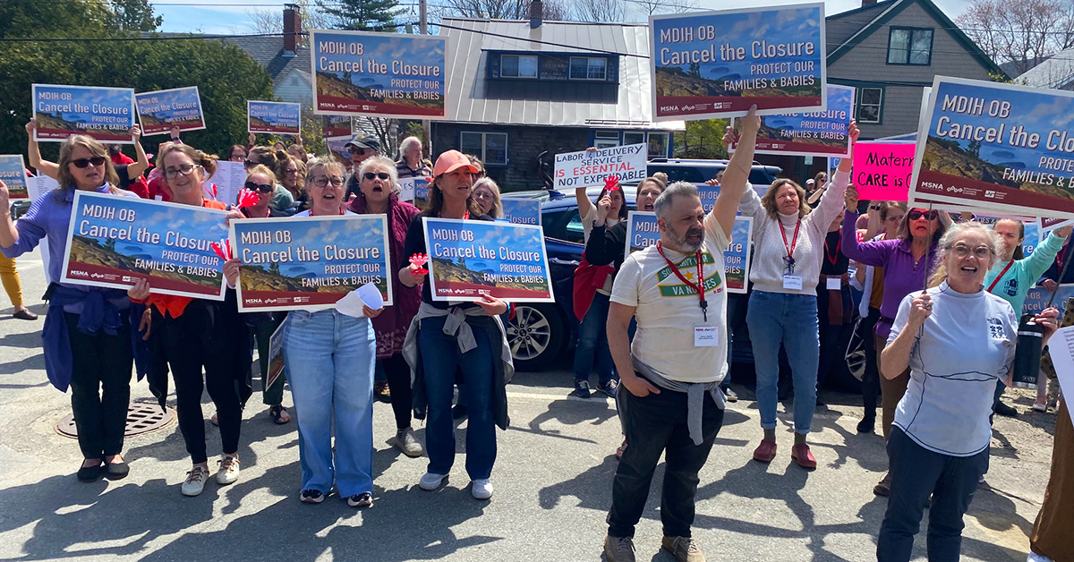 Nurses and community outside holding signs "MDIH OB: Cancel The Closure"
