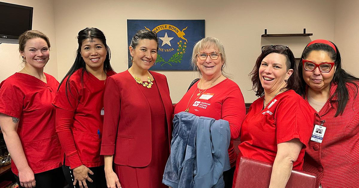 Five nurses standing, smiling with Nevada State Sen. Rochelle Nguyen