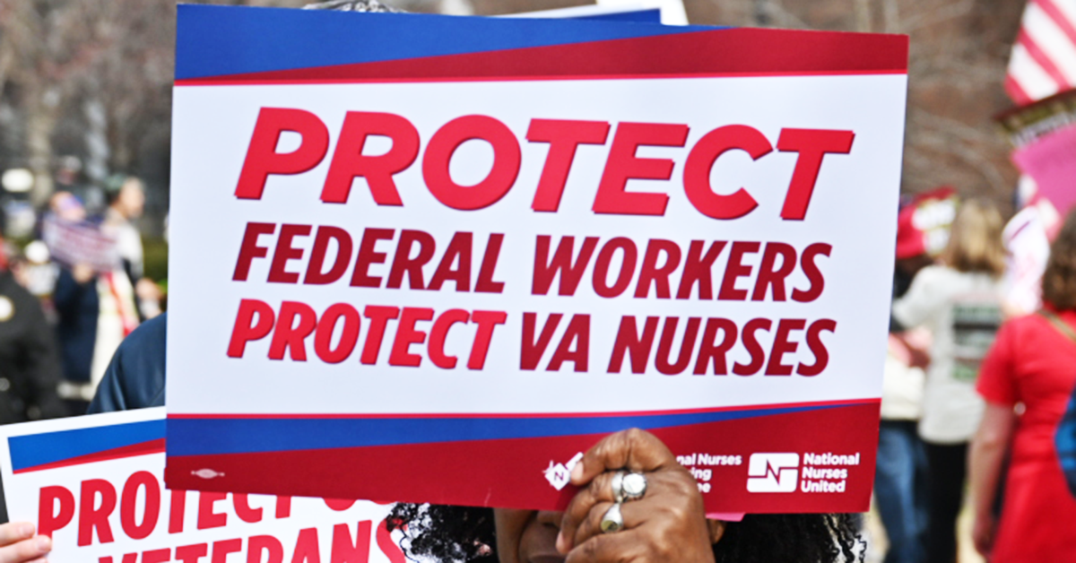 Nurse holding sign "Protect federal workers. Protect VA nurses"