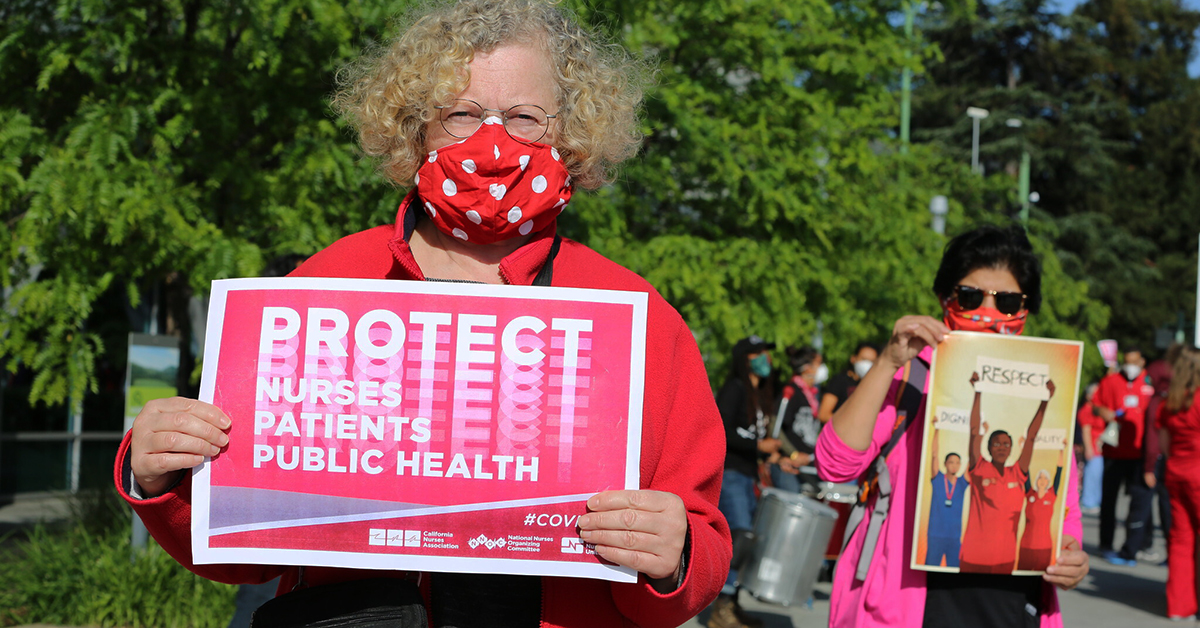Nurse holding sign "Protect Nurses, Patients, Public Health"