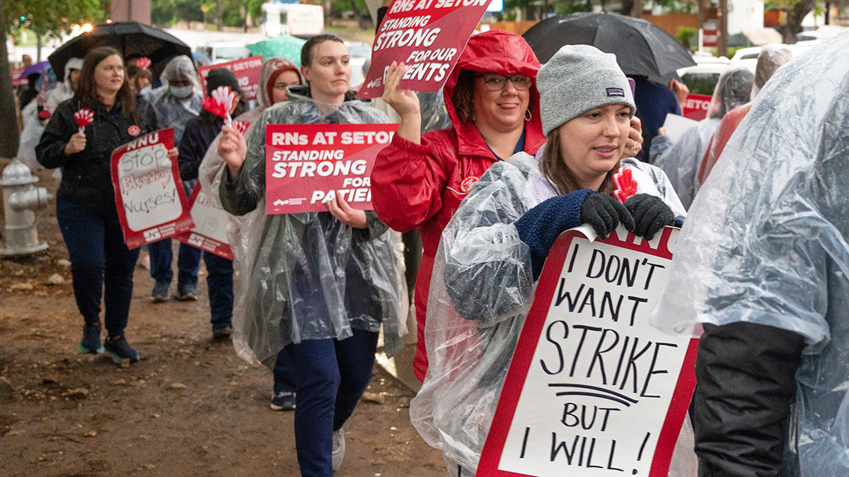 Nurses picketing in the rain