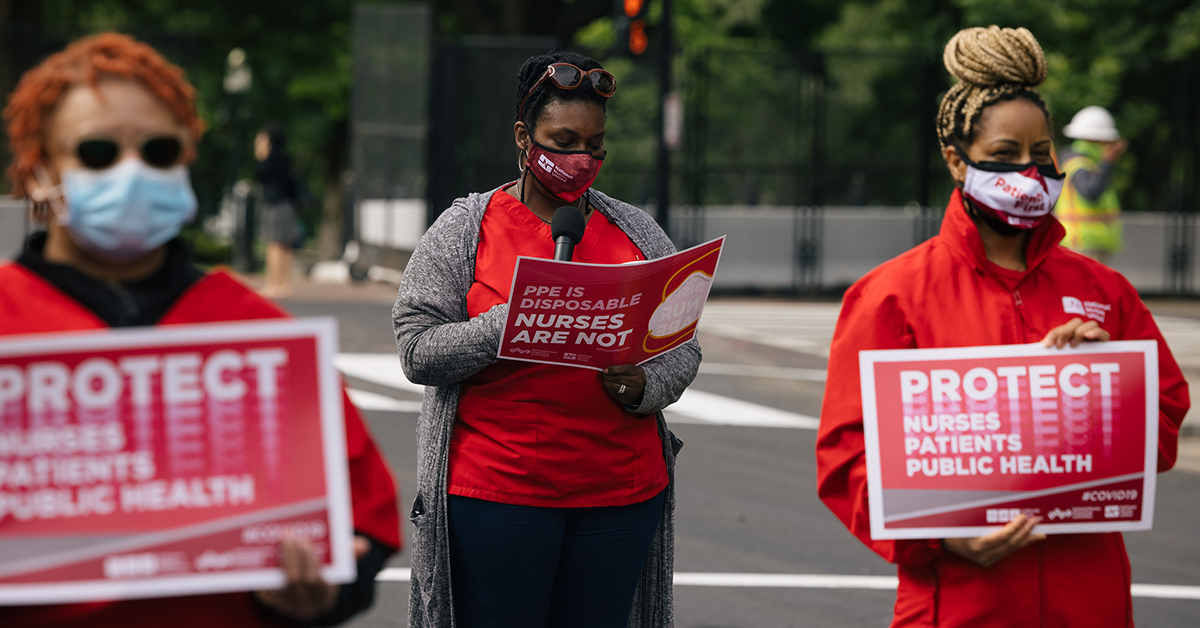 Nurses holds signs "Protect Nurses, Patients, Public Health"