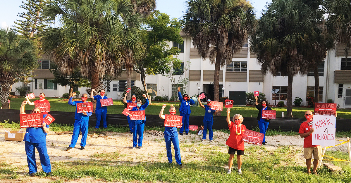Nurses in Florida with signs "Save Lives: Safe Staffing Now" "Honk 4 Heroes"