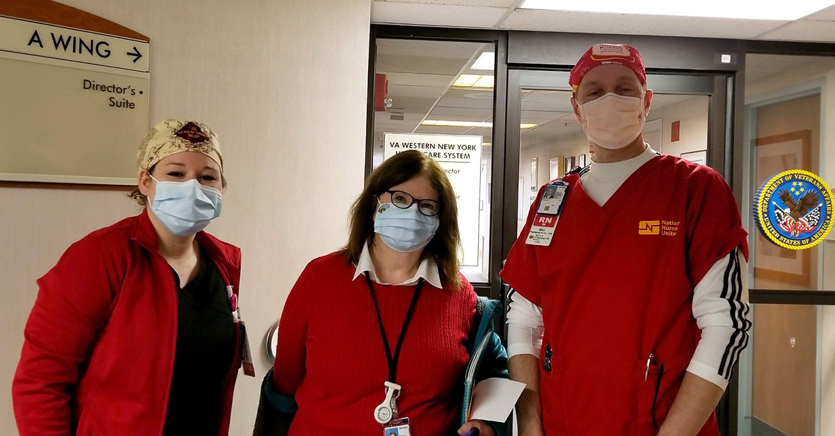 Three nurses outside hospital