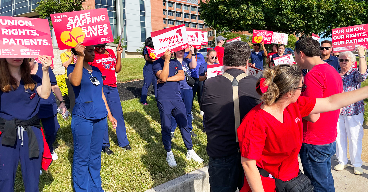 St. Agnes nurses holding signs "Our Union. Our Rights. Our Patients." "Safe Staffing saves lives" "Patients first in the hospital"